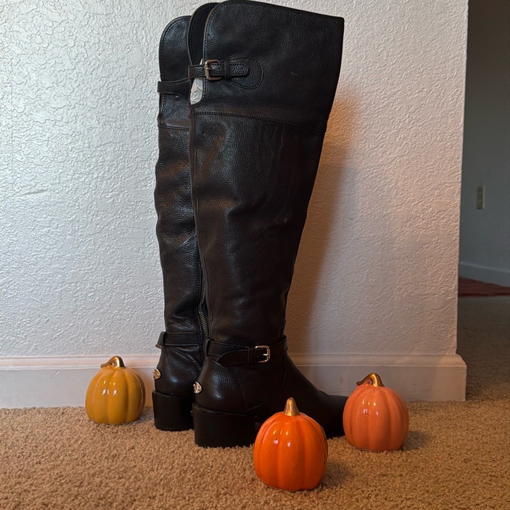 COACH Black leather knee high boots with silver hardware.